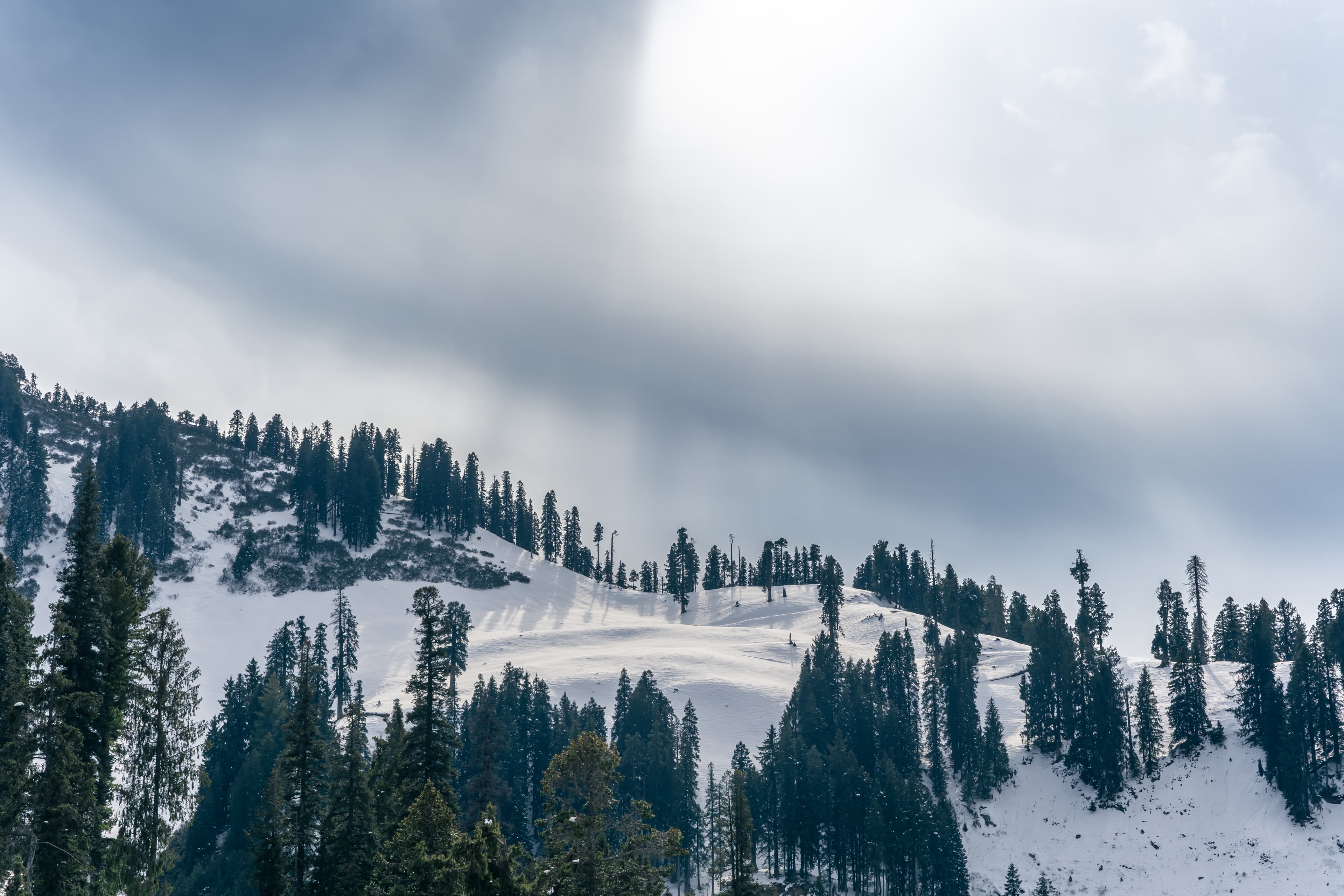 Whispers of Light Over Guldanda's Snowy Slopes
