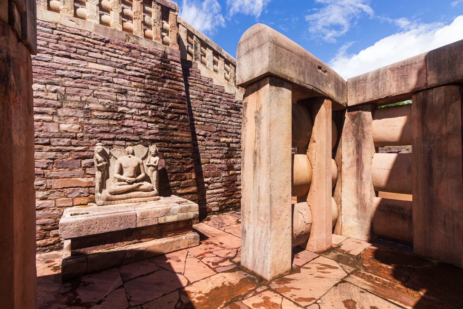 Seated Buddha Relief at Sanchi Stupa – Inner Sanctum View
